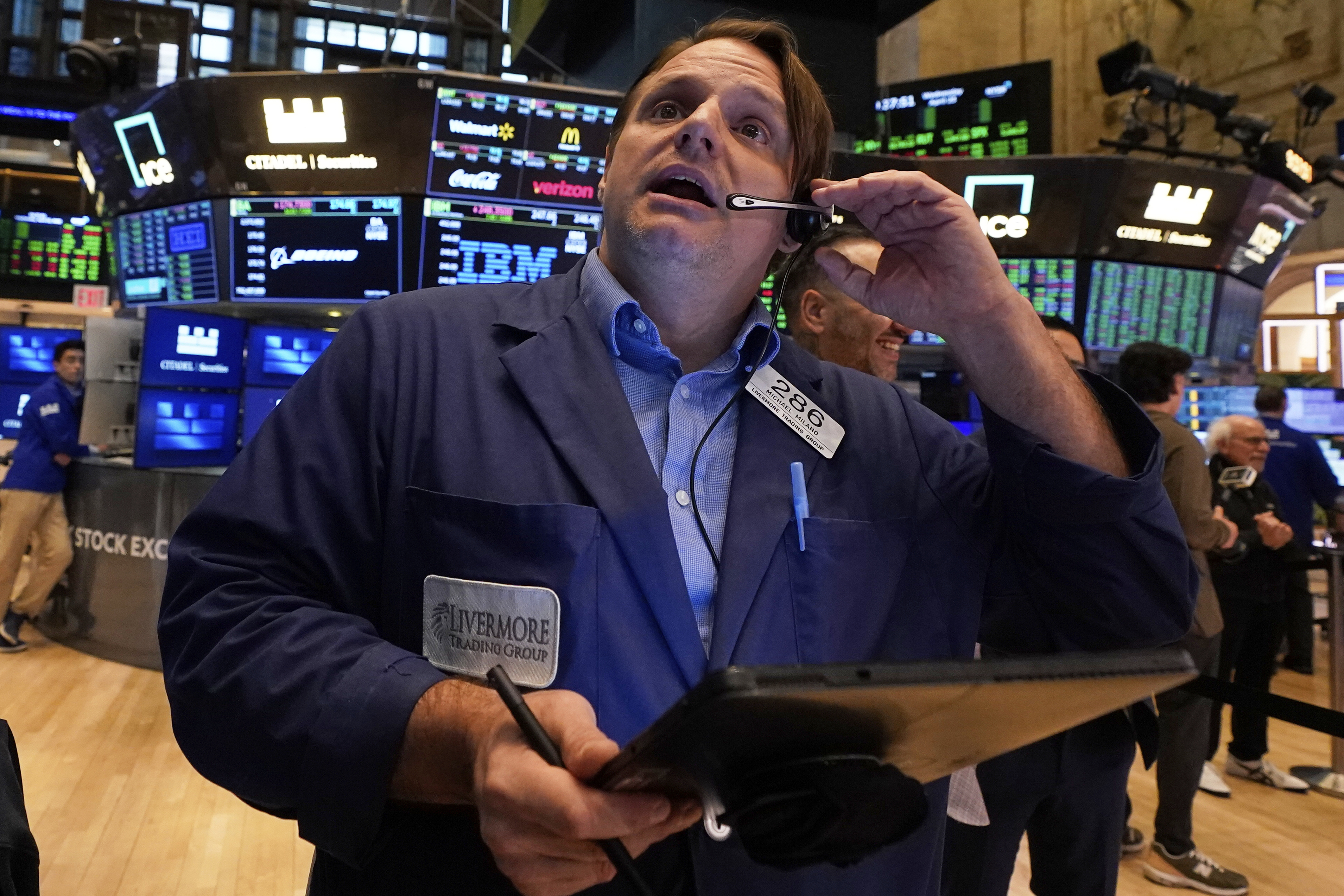 Trader Michael Milano works on the floor of the New York Stock Exchange, Wednesday, April 23, 2025. (AP Photo/Richard Drew)