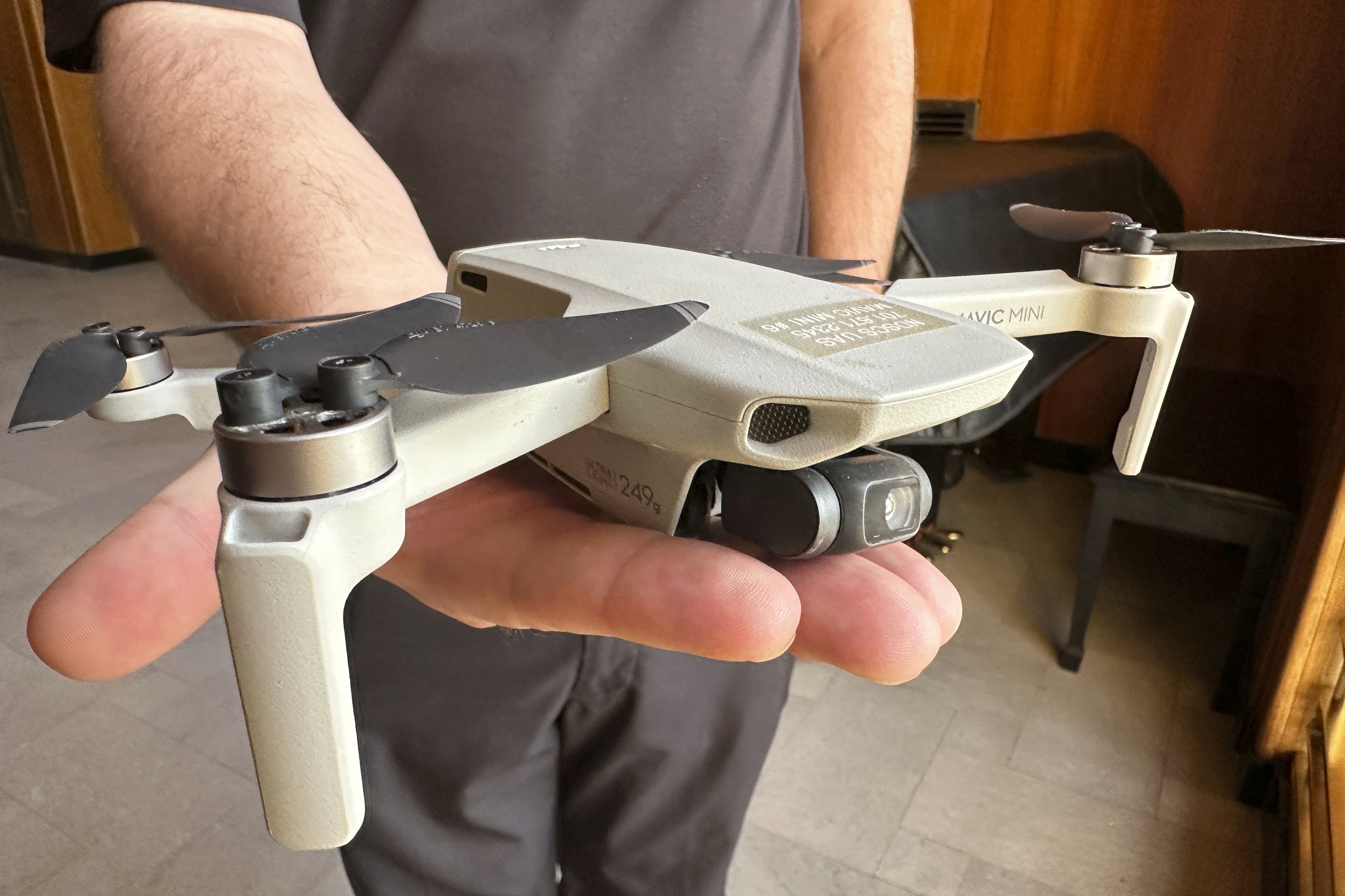 FILE - Seth Simonson, assistant professor and UAS curriculum lead for the North Dakota State College of Science, holds a Chinese-manufactured drone used in class, on Jan. 15, 2025, at the state Capitol in Bismarck, N.D. (AP Photo/Jack Dura, File)